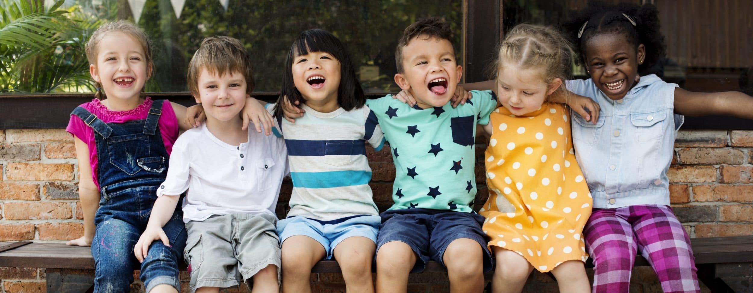 A group of young children smiling